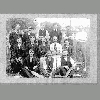 seated, middle of second row